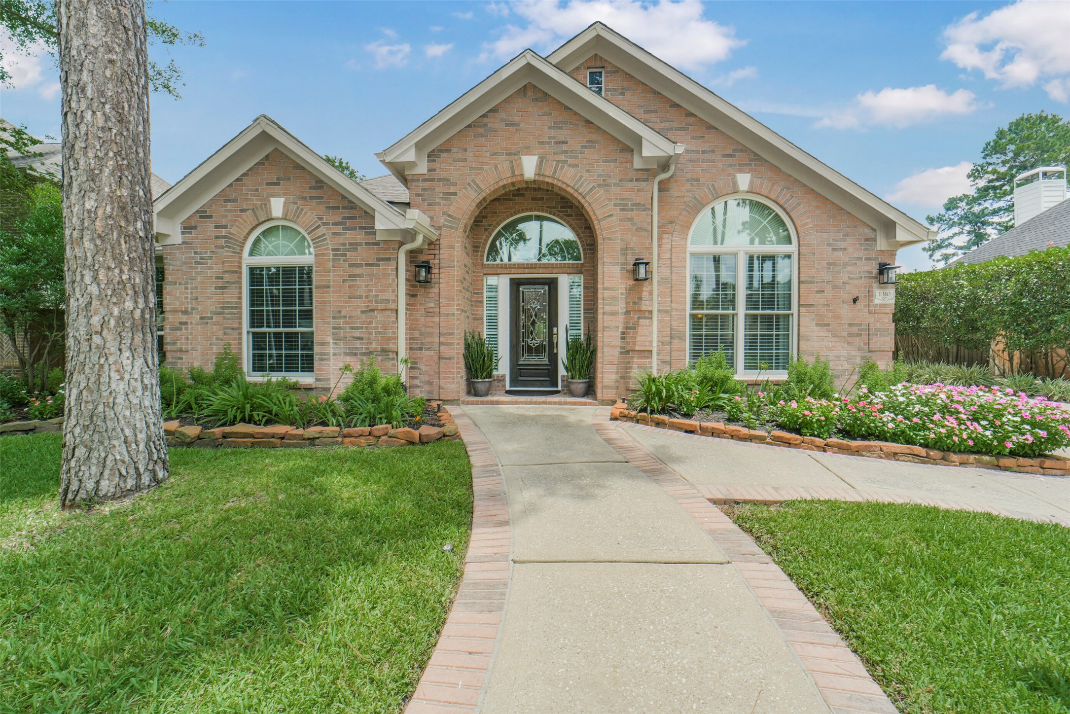 1310 Lambourne Circle Spring, TX 77379 - Photo 3 of 50 Recently installed Double pane windows throughout. Exterior washed, caulked, repainted whole house. 6" custom gutters with leaf guards & downspouts.