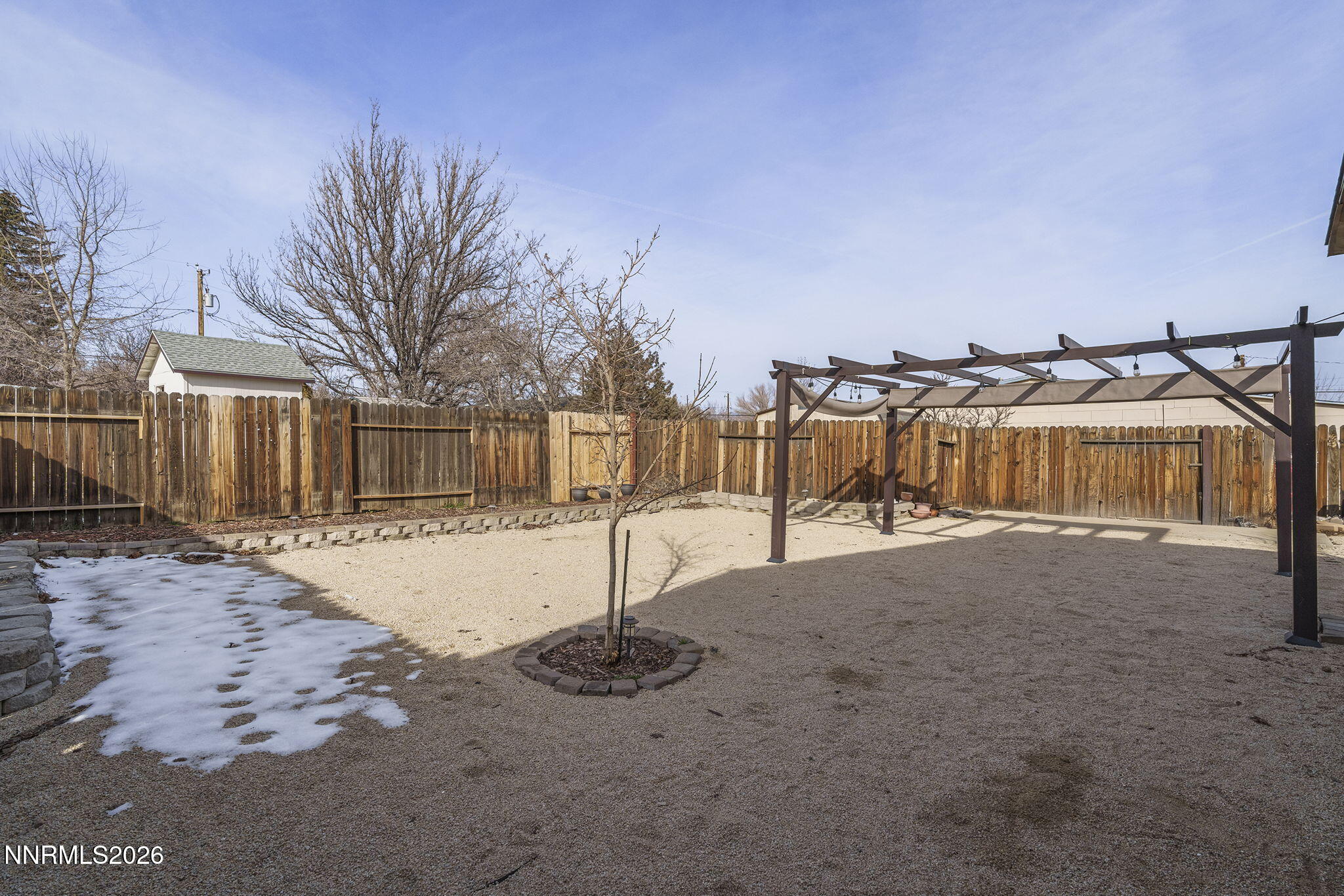 11303 Rocky Mountain Street Reno, NV 89506 - Photo 27 of 28 a street view with large trees