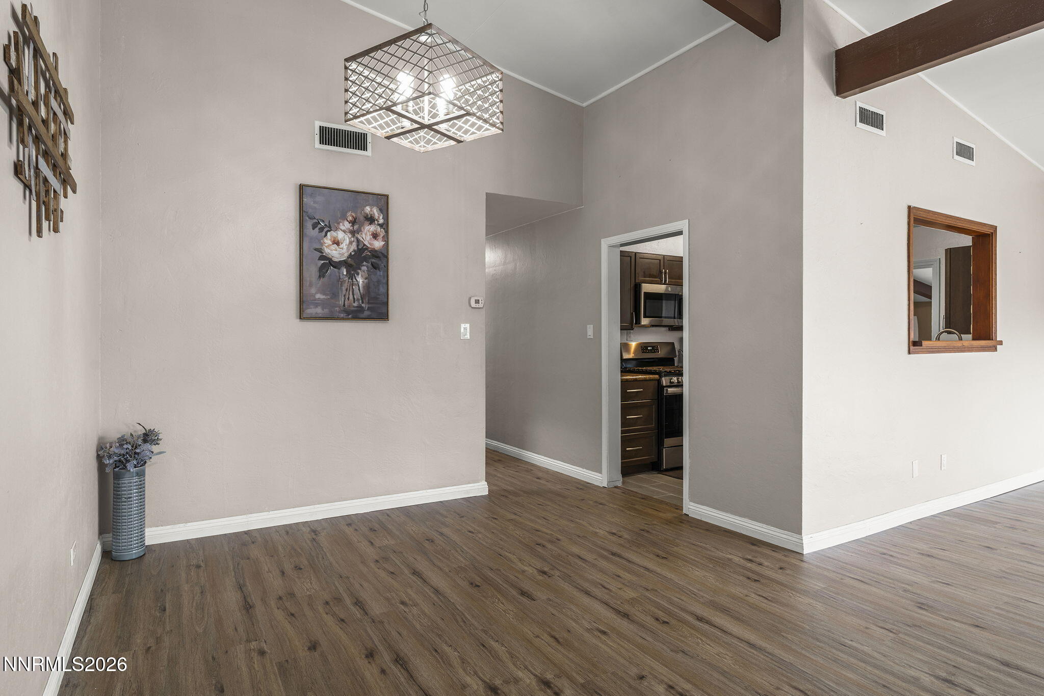 11303 Rocky Mountain Street Reno, NV 89506 - Photo 10 of 28 wooden floor in an empty room with a window