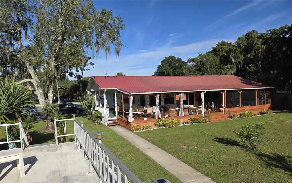 601 Southeast 6th Avenue Okeechobee, FL 34974 - Photo 1 of 1 a view of a house with a yard porch and sitting area