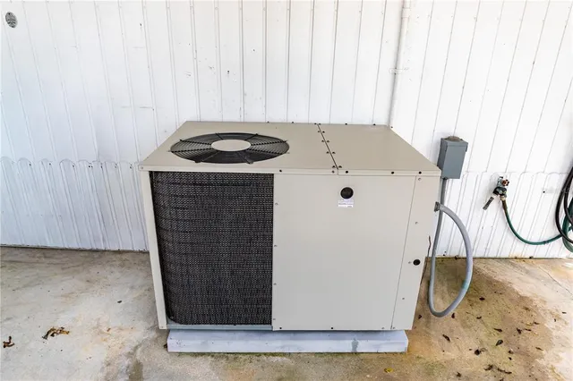 a swimming pool with outdoor seating and yard