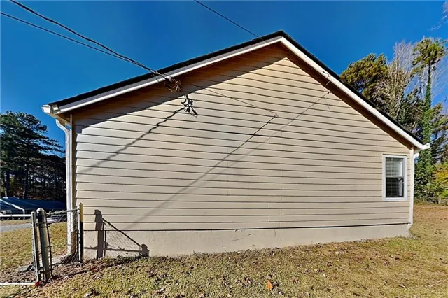 a view of house with backyard