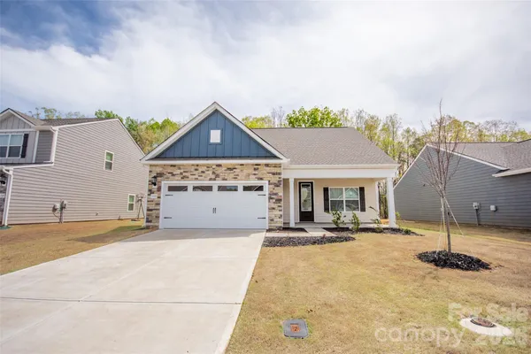 a front view of a house with a garage