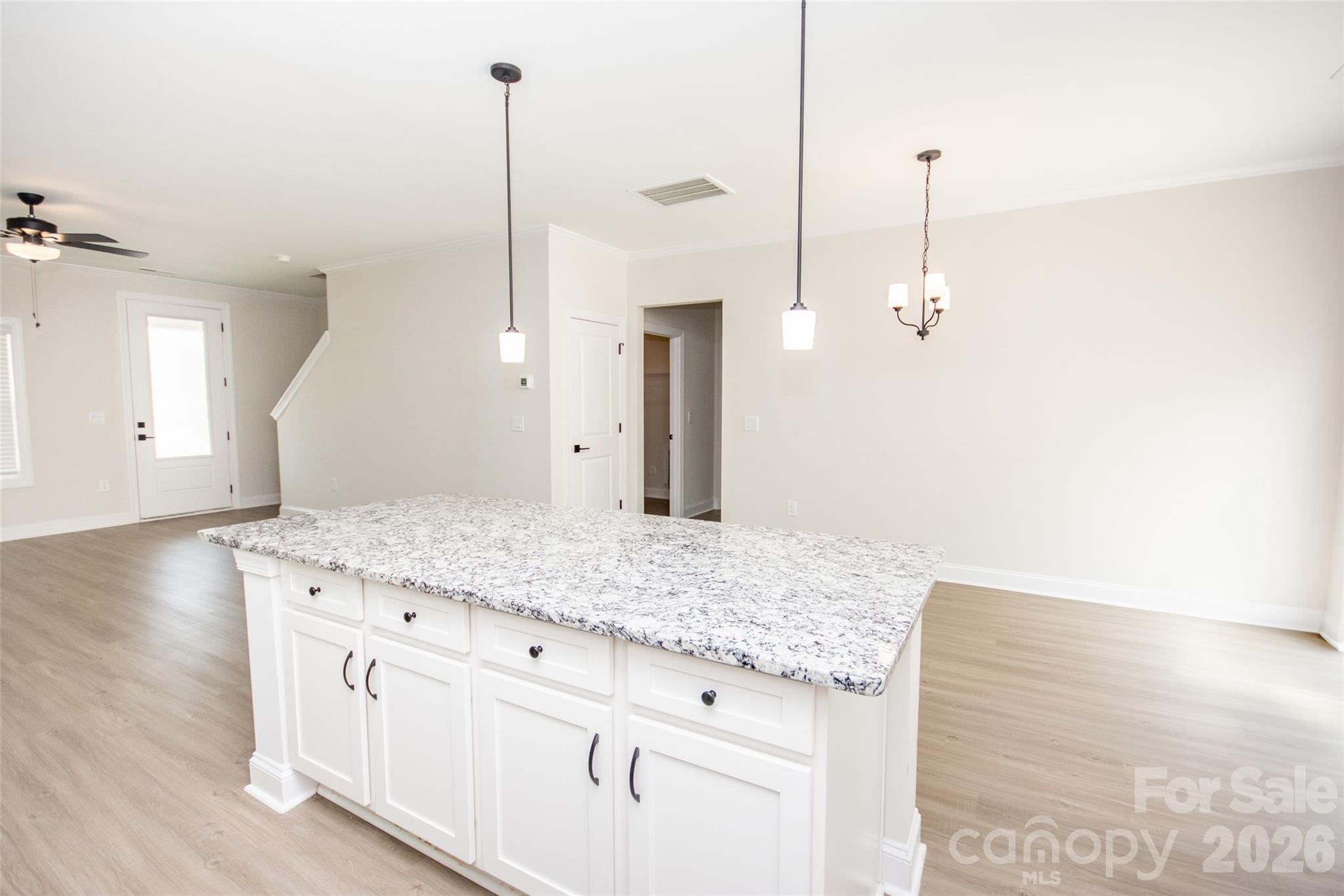 109 Brixham Loop Troutman, NC 28166 - Photo 18 of 44 a bathroom with a granite countertop sink and a mirror