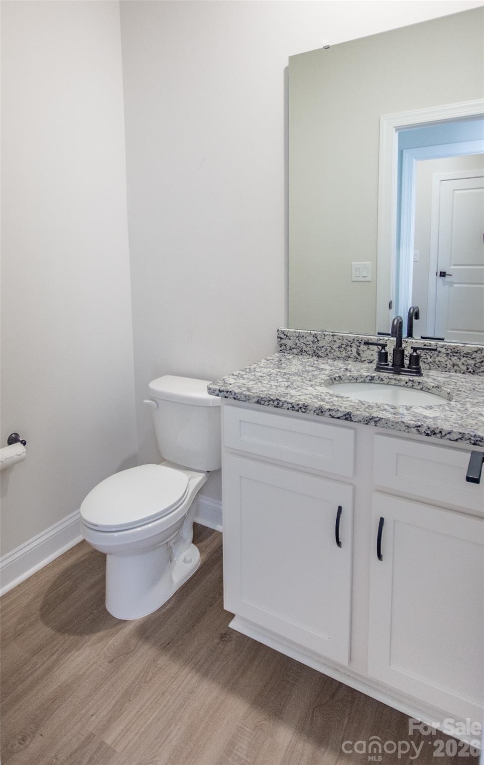 109 Brixham Loop Troutman, NC 28166 - Photo 21 of 44 a white toilet sitting next to a bathroom sink