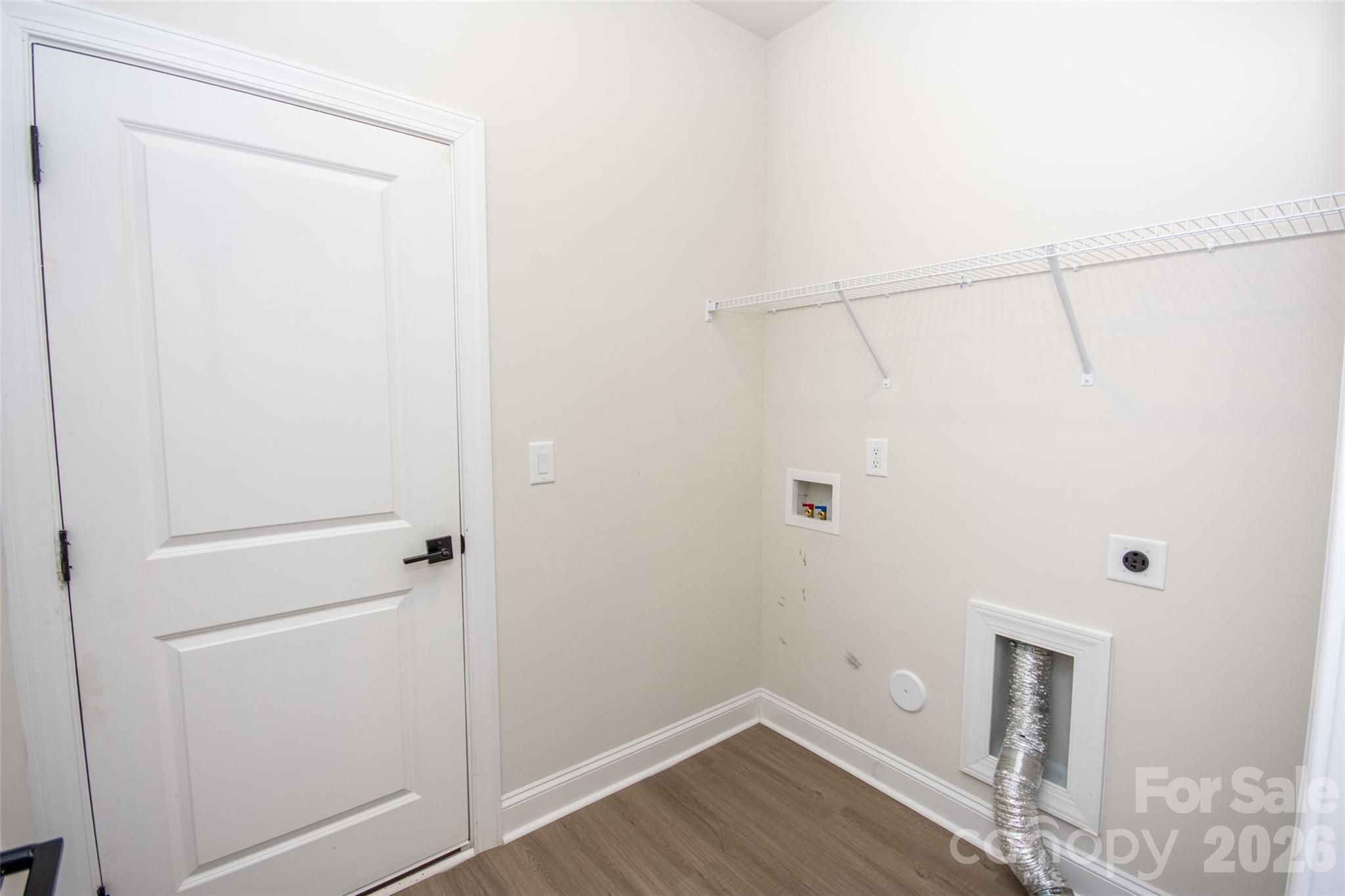 109 Brixham Loop Troutman, NC 28166 - Photo 22 of 44 a view of a room with wooden floor