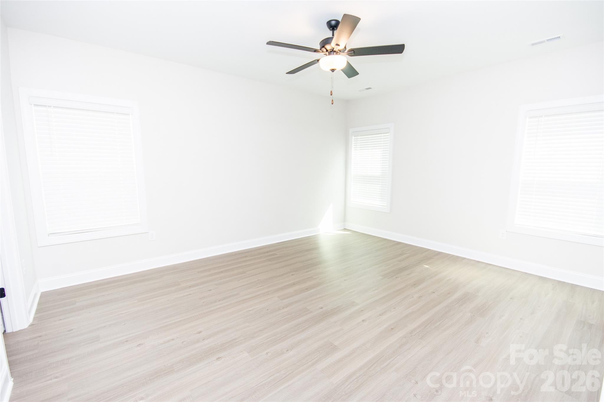 109 Brixham Loop Troutman, NC 28166 - Photo 24 of 44 a view of a big room with wooden floor