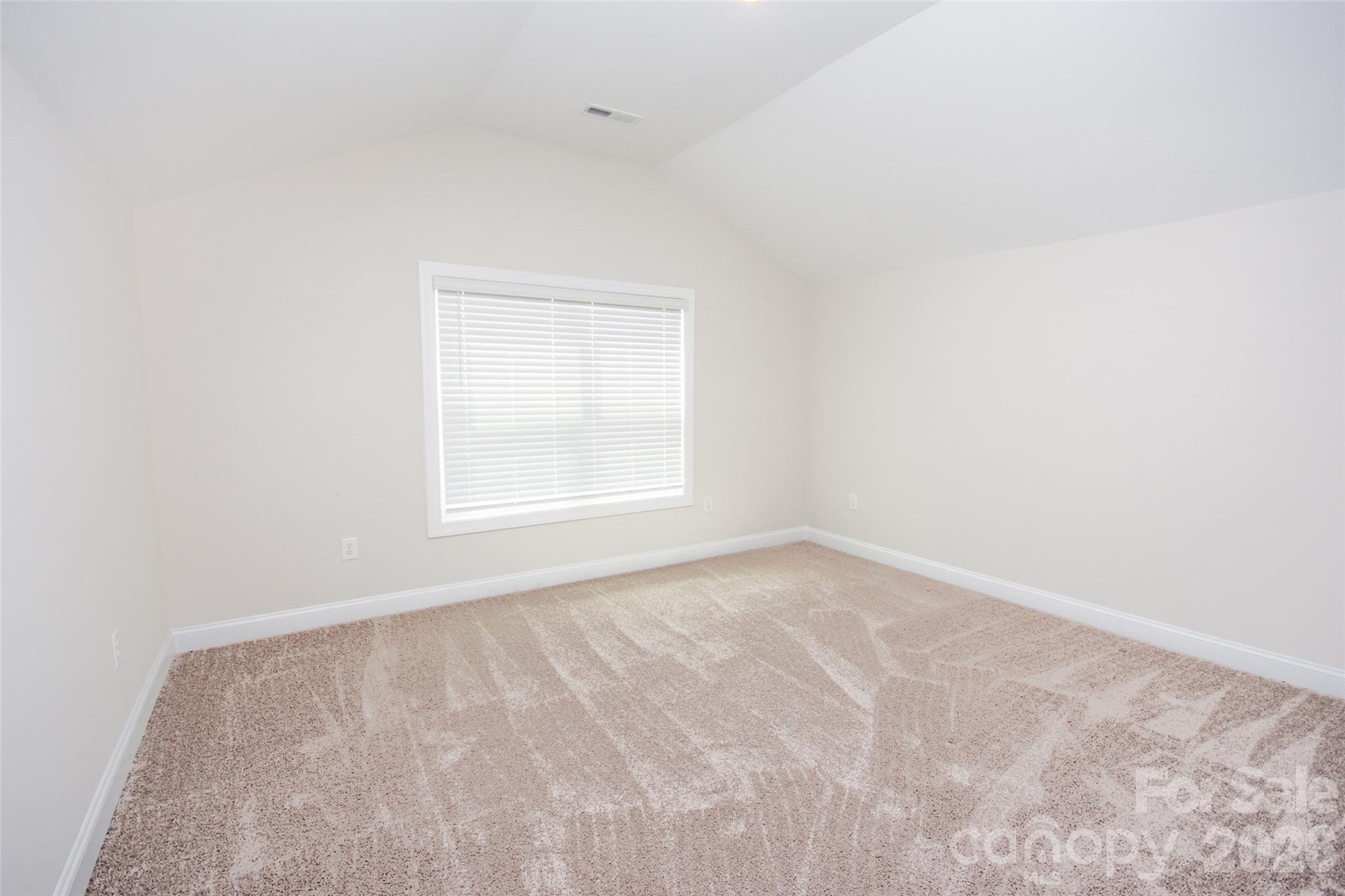 109 Brixham Loop Troutman, NC 28166 - Photo 30 of 44 a view of an empty room with a window