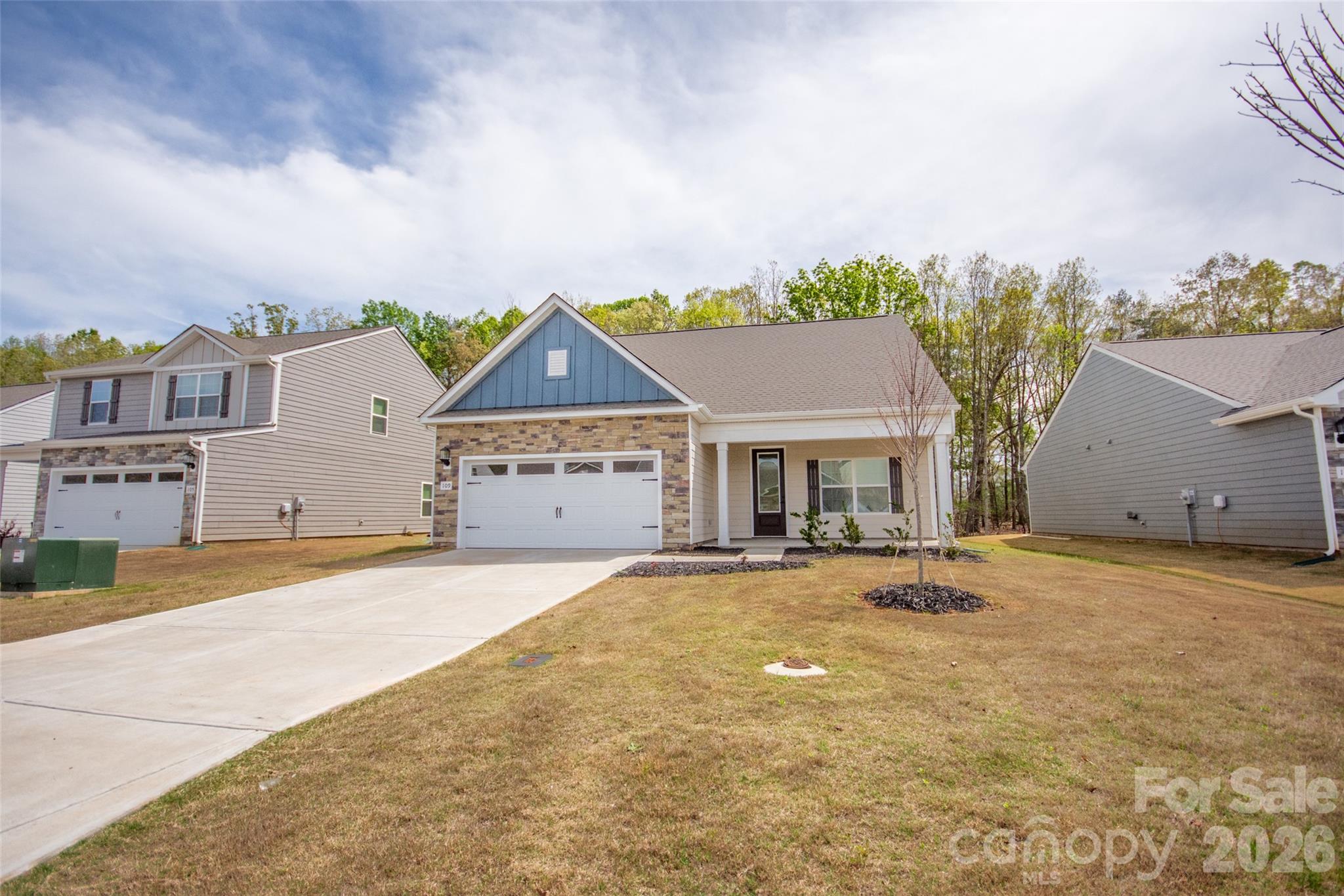 109 Brixham Loop Troutman, NC 28166 - Photo 4 of 44 front view of a house with a street