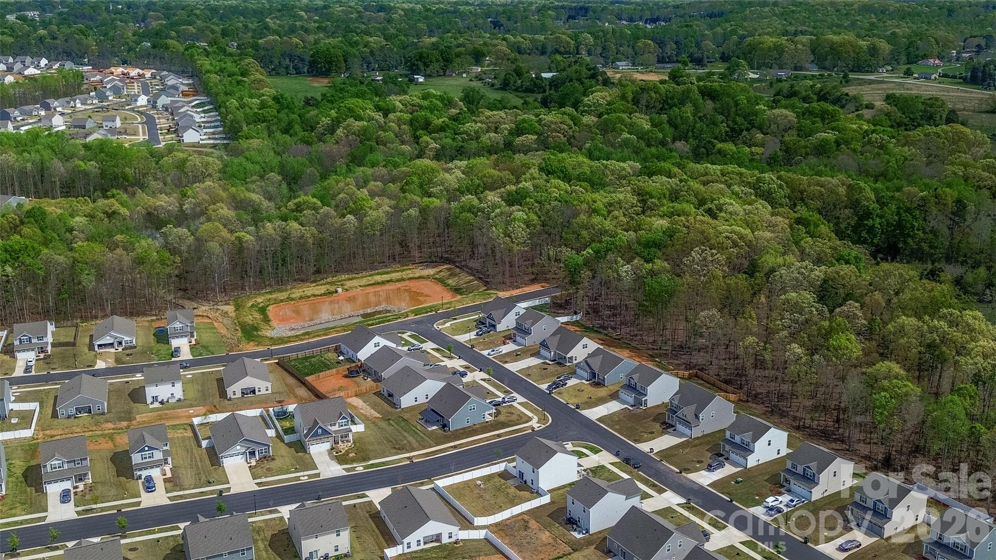 109 Brixham Loop Troutman, NC 28166 - Photo 44 of 44 an aerial view of residential houses with outdoor space