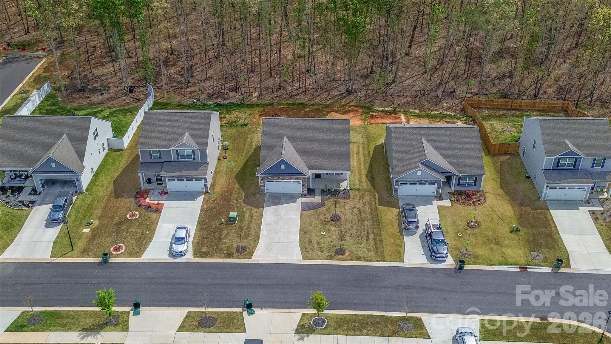 109 Brixham Loop Troutman, NC 28166 - Photo 7 of 44 an aerial view of residential houses with outdoor space