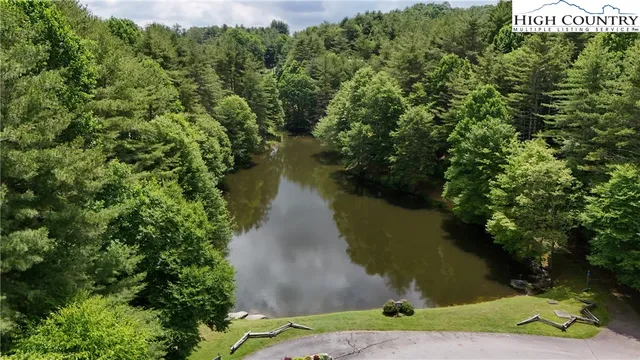 an aerial view of a houses with outdoor space and street view