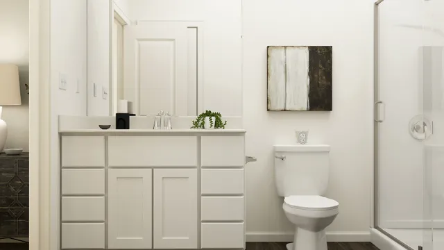 a bathroom with a sink toilet and mirror