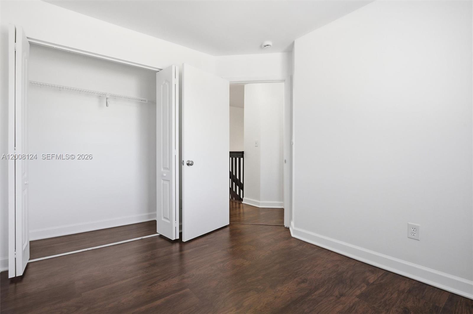 17530 Southwest 139th Court Miami, FL 33177 - Photo 23 of 35 an empty room with wooden floor