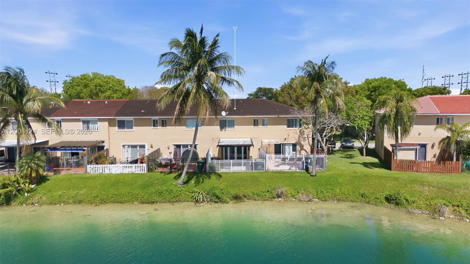 17530 Southwest 139th Court Miami, FL 33177 - Photo 27 of 35 a view of a house with swimming pool and a yard