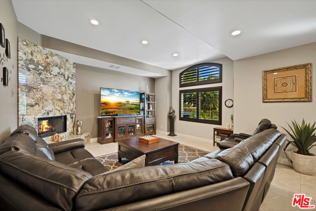 5437 Middlecrest Road Rancho Palos Verdes, CA 90275 - Photo 11 of 32 a living room with furniture and a flat screen tv