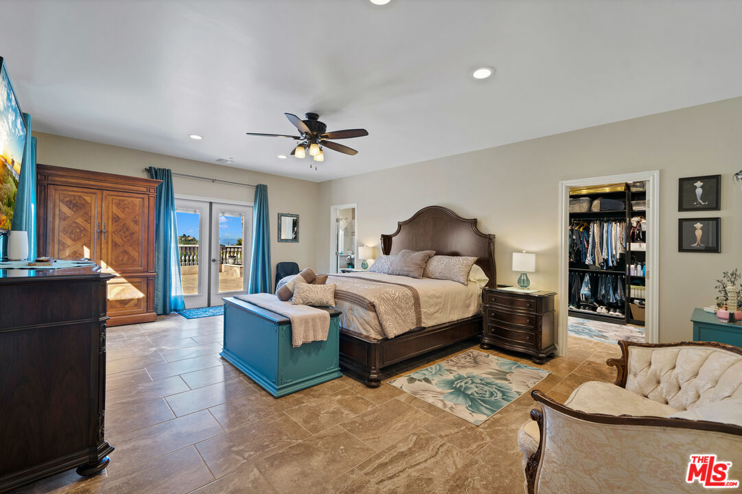 5437 Middlecrest Road Rancho Palos Verdes, CA 90275 - Photo 12 of 32 a bedroom with a bed and wooden floor