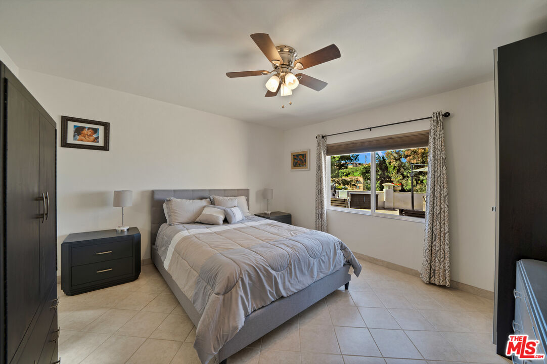 5437 Middlecrest Road Rancho Palos Verdes, CA 90275 - Photo 17 of 32 a bedroom with a bed and window