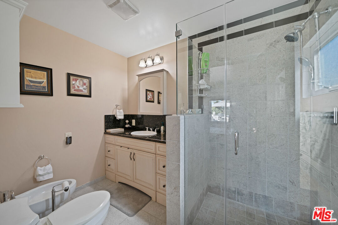 5437 Middlecrest Road Rancho Palos Verdes, CA 90275 - Photo 18 of 32 a bathroom with a sink a toilet and shower