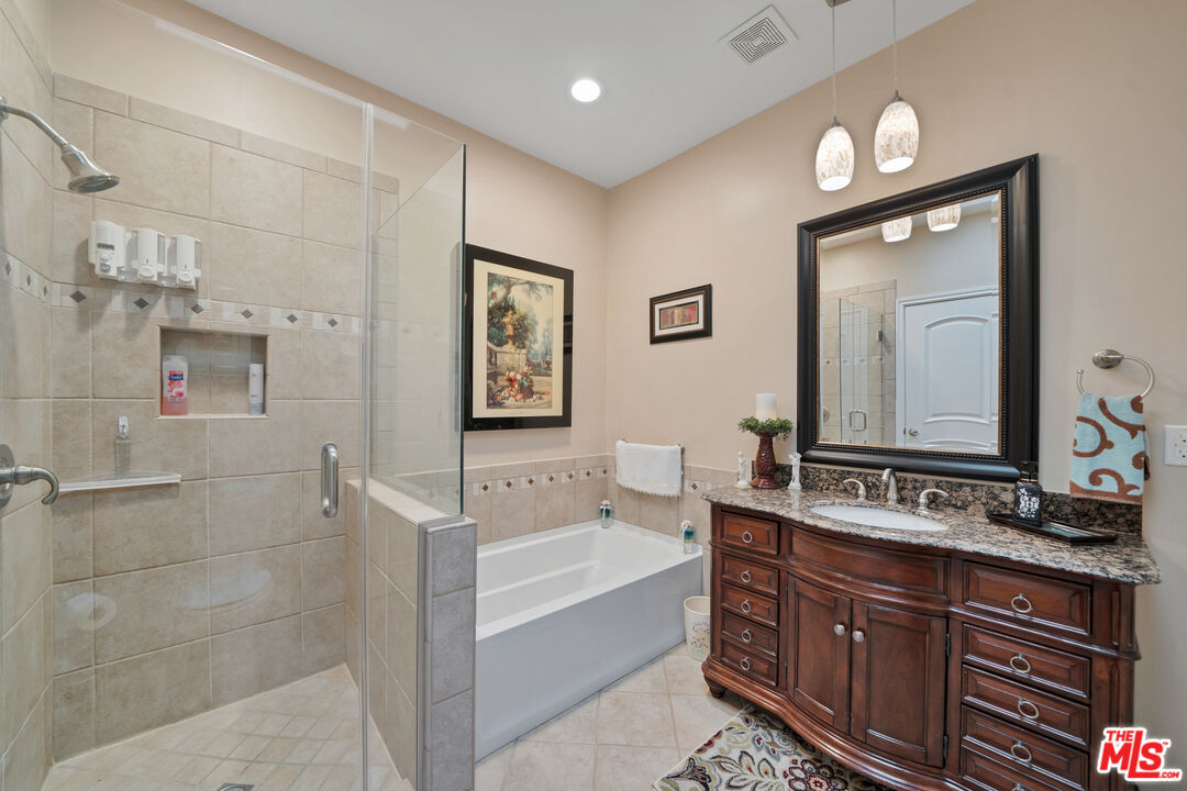 5437 Middlecrest Road Rancho Palos Verdes, CA 90275 - Photo 19 of 32 a bathroom with a bathtub shower sink and mirror