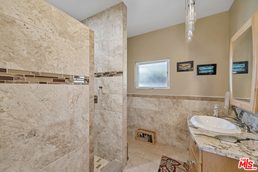 5437 Middlecrest Road Rancho Palos Verdes, CA 90275 - Photo 20 of 32 a bathroom with a sink and a mirror