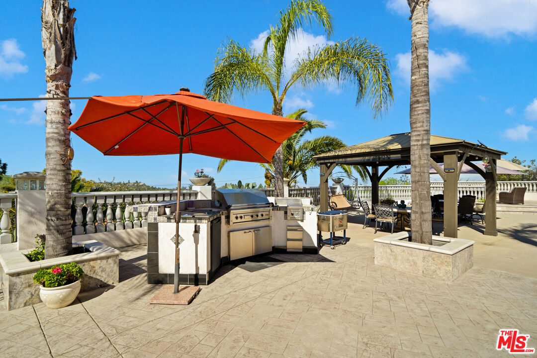 5437 Middlecrest Road Rancho Palos Verdes, CA 90275 - Photo 24 of 32 a view of a chairs and tables in the patio