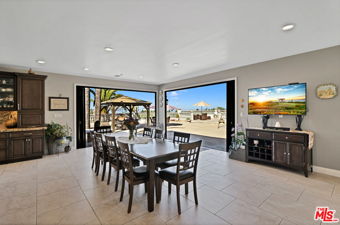 5437 Middlecrest Road Rancho Palos Verdes, CA 90275 - Photo 7 of 32 a view of a dining room with furniture window and outside view
