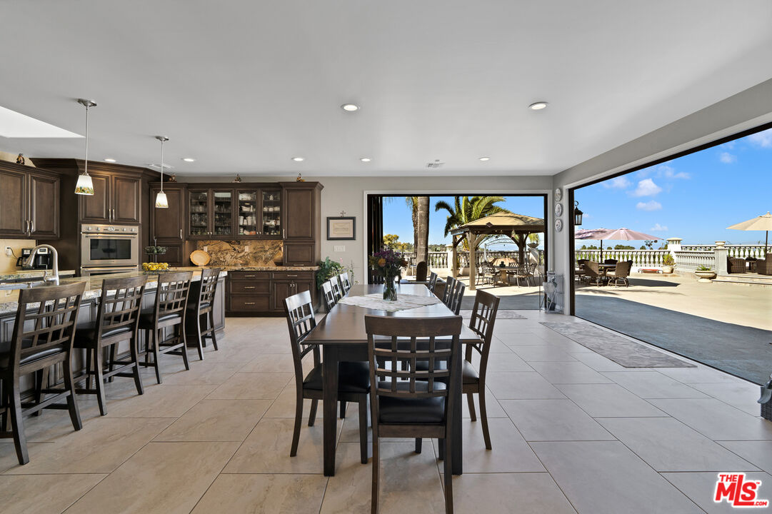 5437 Middlecrest Road Rancho Palos Verdes, CA 90275 - Photo 8 of 32 a view of a dining area with furniture window and outside view