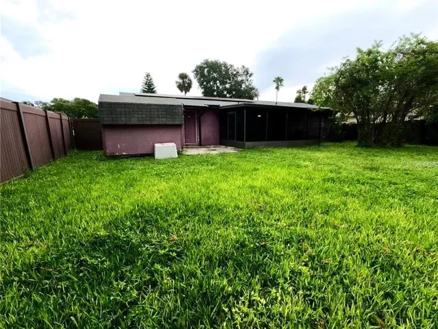 a view of outdoor space with deck and yard