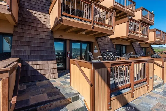 a view of a house with iron stairs