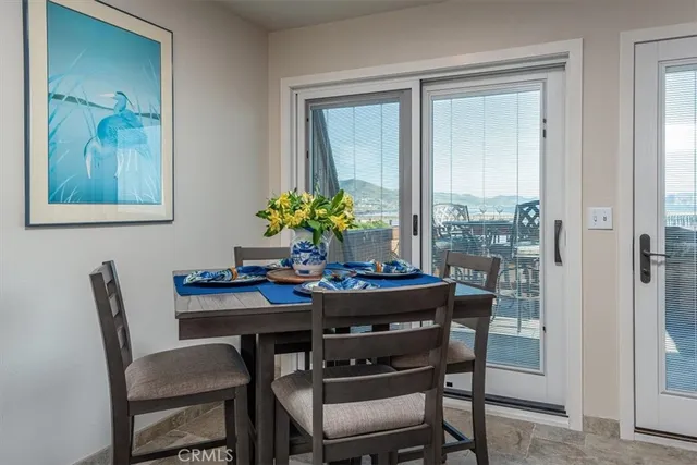 a view of a dining room with furniture and window