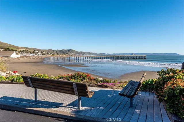 a view of a balcony with wooden floor and city view