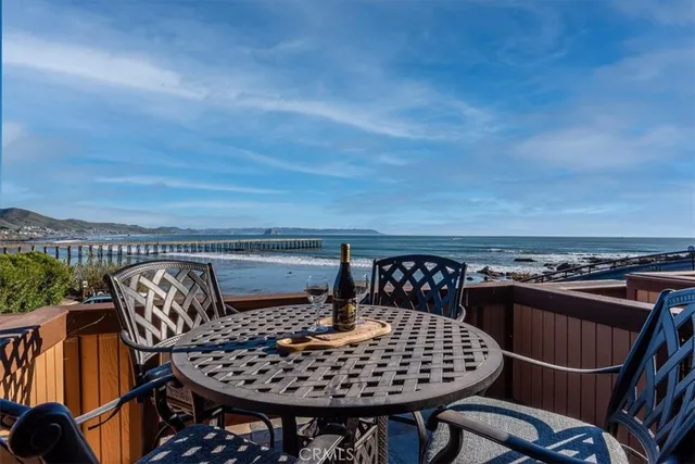 a table and chairs sitting in a roof deck