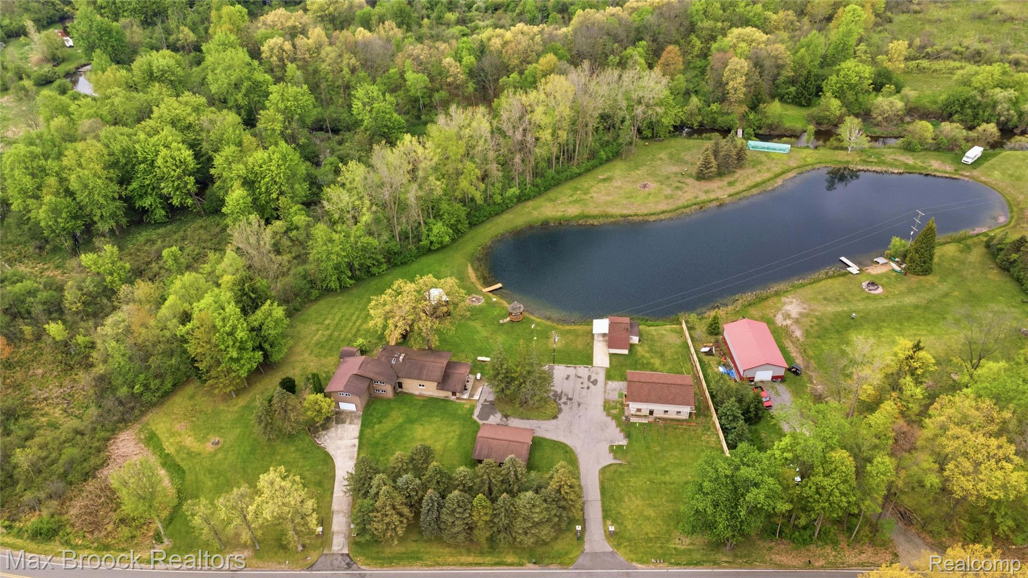 1392 Maple Grove Road Lapeer, MI 48446 - Photo 47 of 70 Aerial view of a large body of water and a heavily wooded area