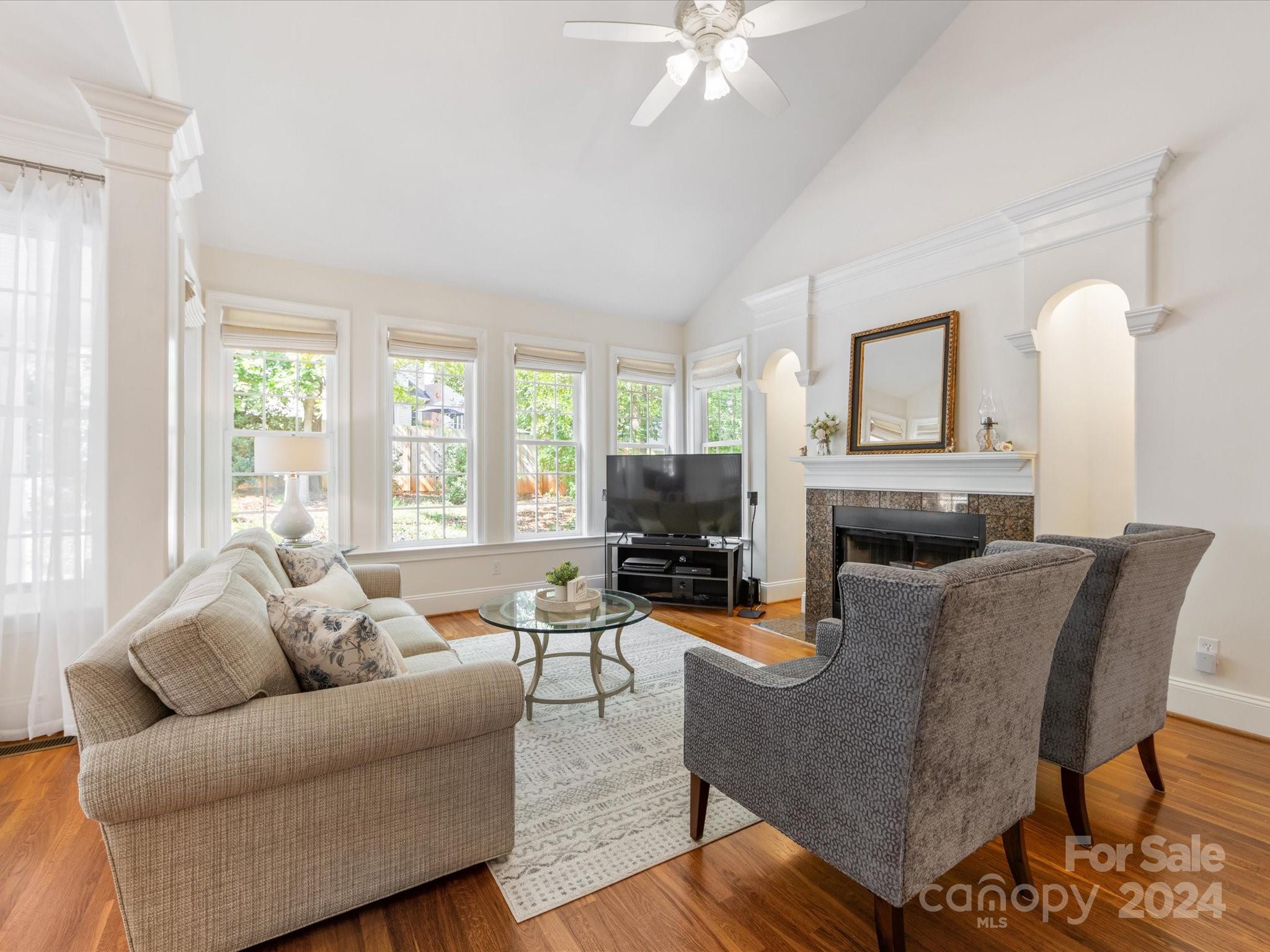 4100 Cherrybrook Drive Mint Hill, NC 28227 - Photo 11 of 45 a living room with furniture a large window and a fireplace