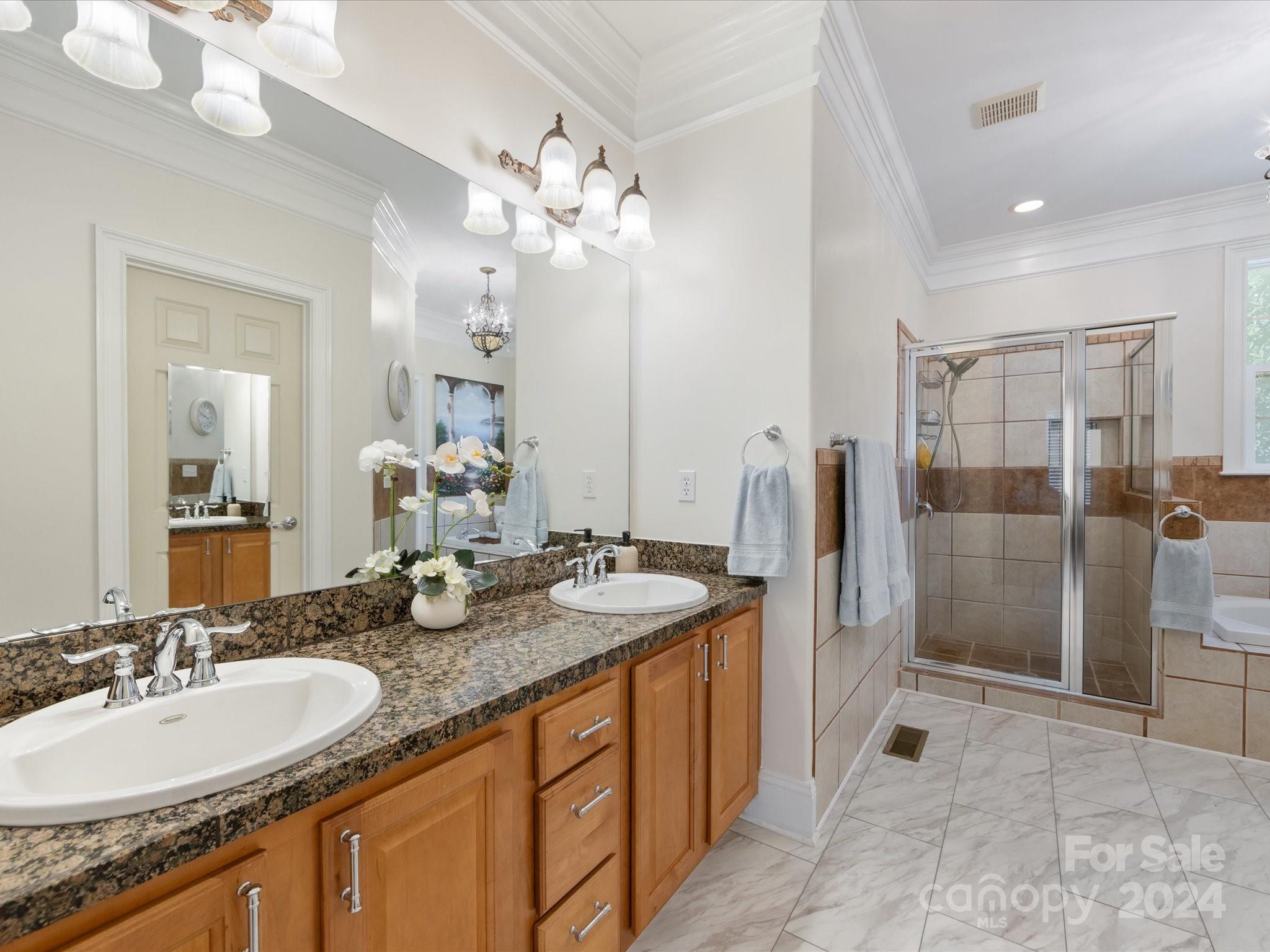 4100 Cherrybrook Drive Mint Hill, NC 28227 - Photo 22 of 45 a bathroom with a granite countertop double vanity sink mirror and shower