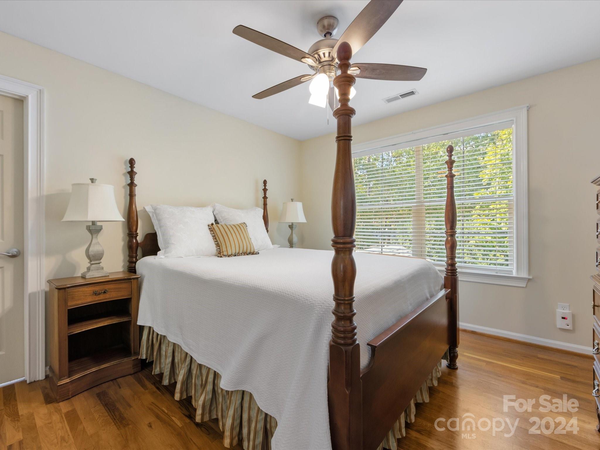 4100 Cherrybrook Drive Mint Hill, NC 28227 - Photo 27 of 45 a bedroom with a bed and a chandelier