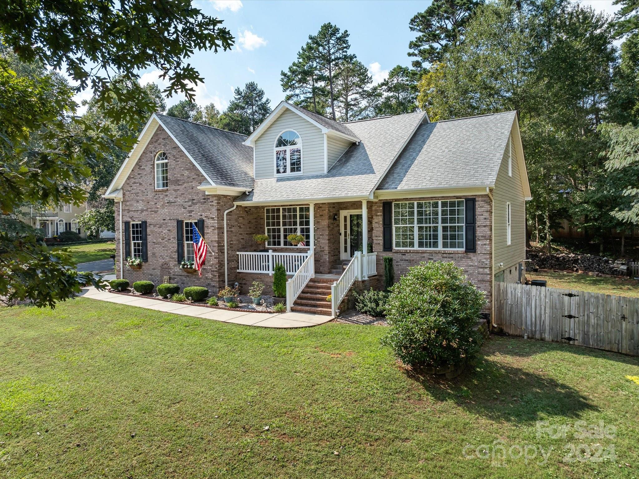 4100 Cherrybrook Drive Mint Hill, NC 28227 - Photo 3 of 45 a front view of house with a garden and porch