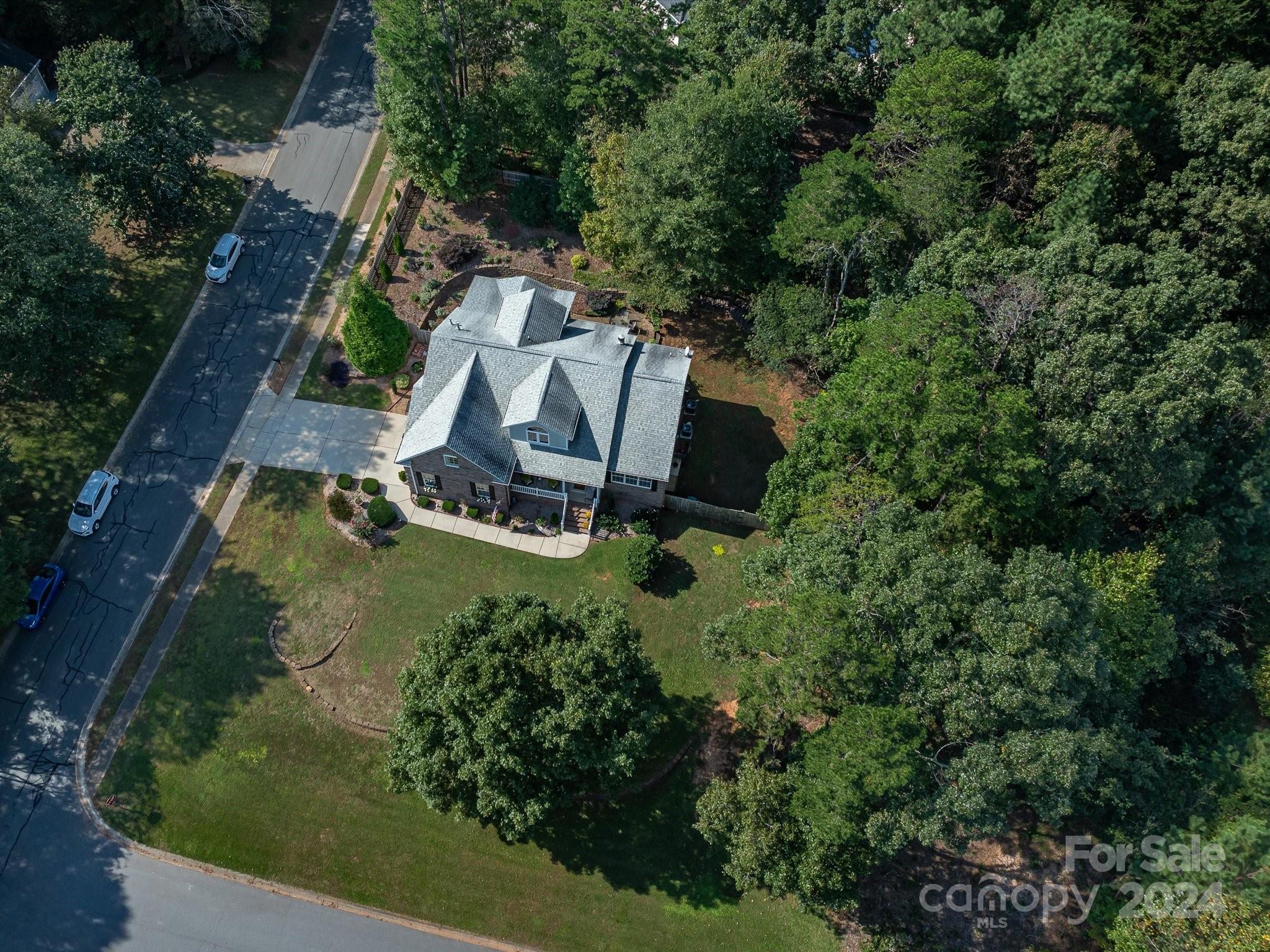 4100 Cherrybrook Drive Mint Hill, NC 28227 - Photo 41 of 45 an aerial view of a house with garden space and sitting area