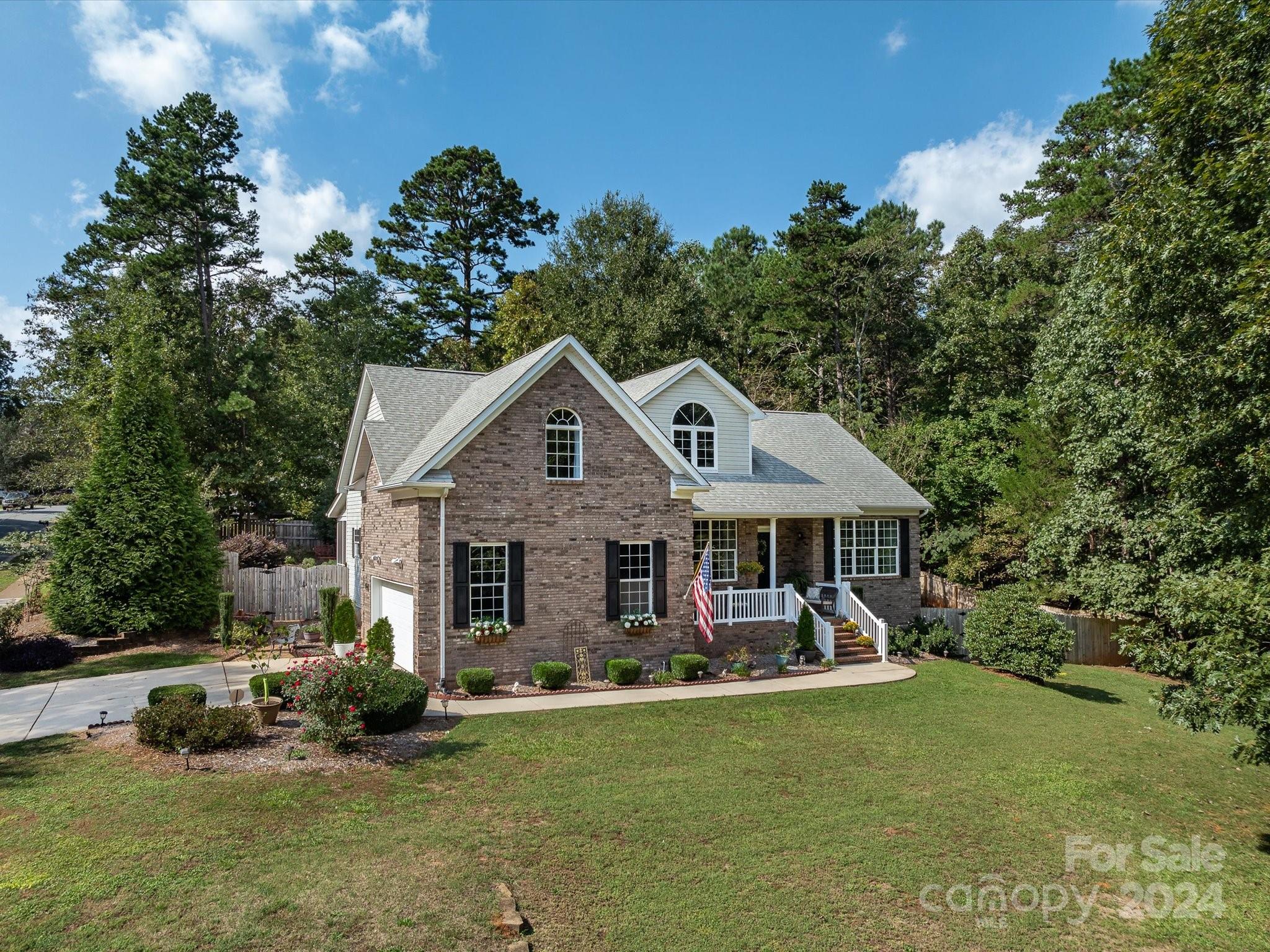 4100 Cherrybrook Drive Mint Hill, NC 28227 - Photo 43 of 45 a view of a house with a yard porch and sitting area