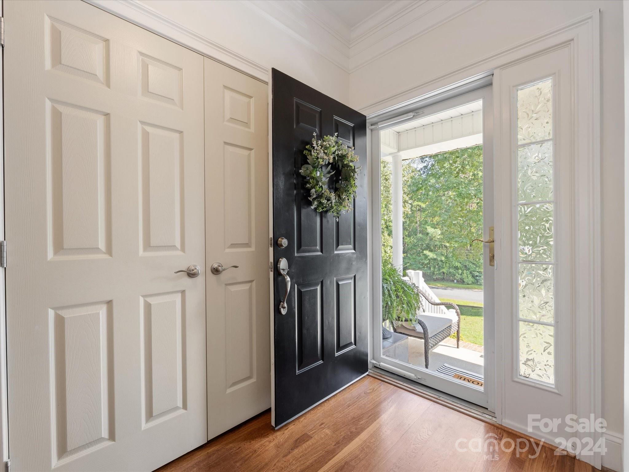 4100 Cherrybrook Drive Mint Hill, NC 28227 - Photo 6 of 45 a view of a livingroom with a furniture window and wooden floor