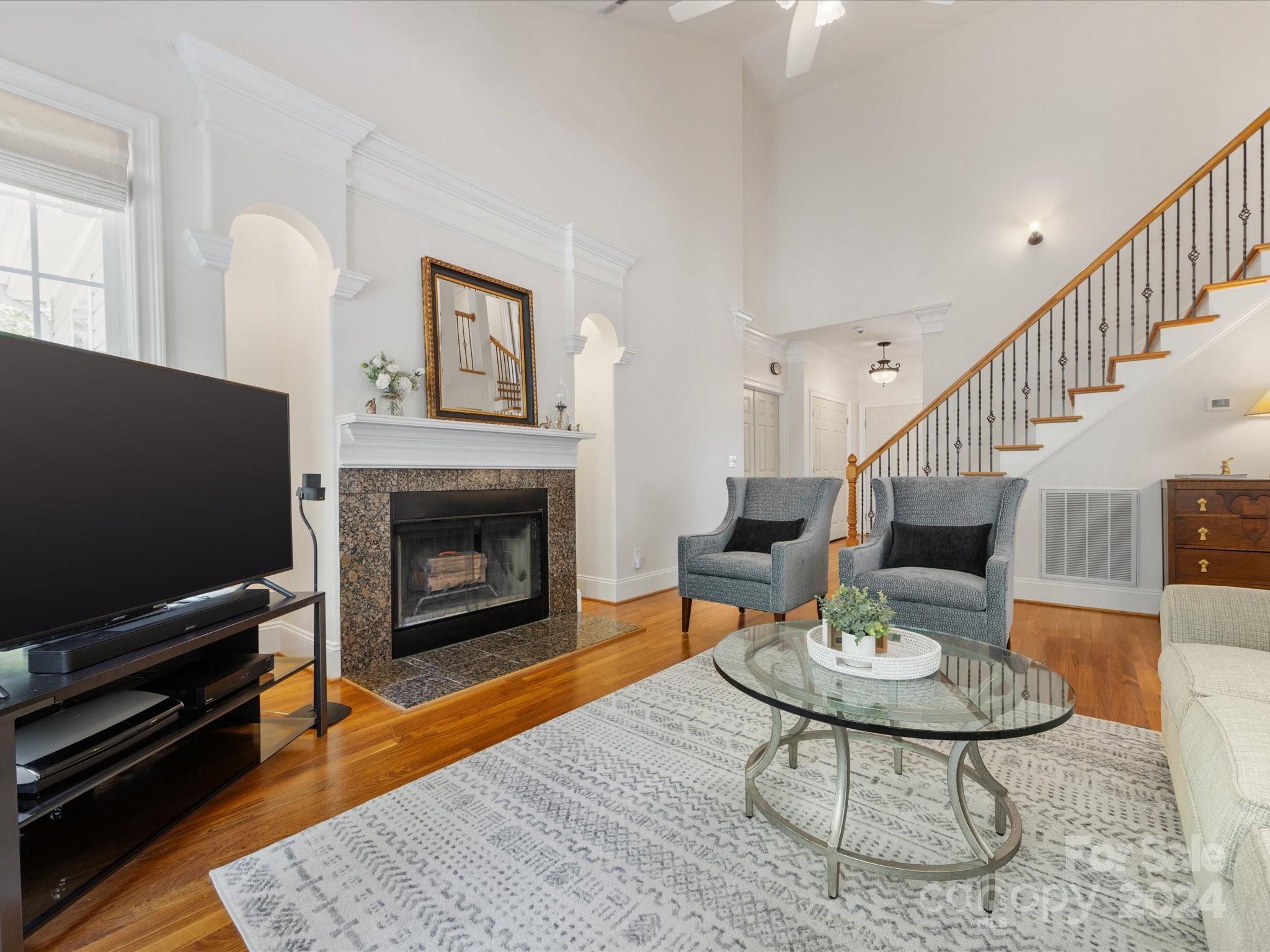 4100 Cherrybrook Drive Mint Hill, NC 28227 - Photo 9 of 45 a living room with furniture a flat screen tv and a fireplace