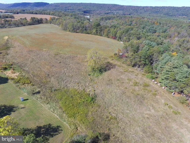 an aerial view of mountain with beach