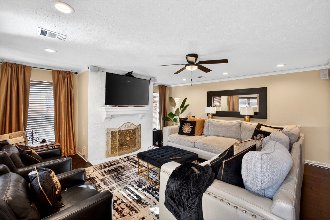19115 Keyturn Lane Humble, TX 77346 - Photo 14 of 32 a living room with furniture fireplace and flat screen tv
