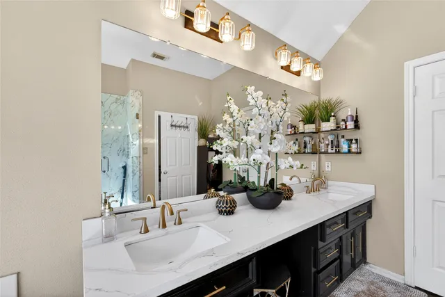 a bathroom with a sink double vanity and a mirror