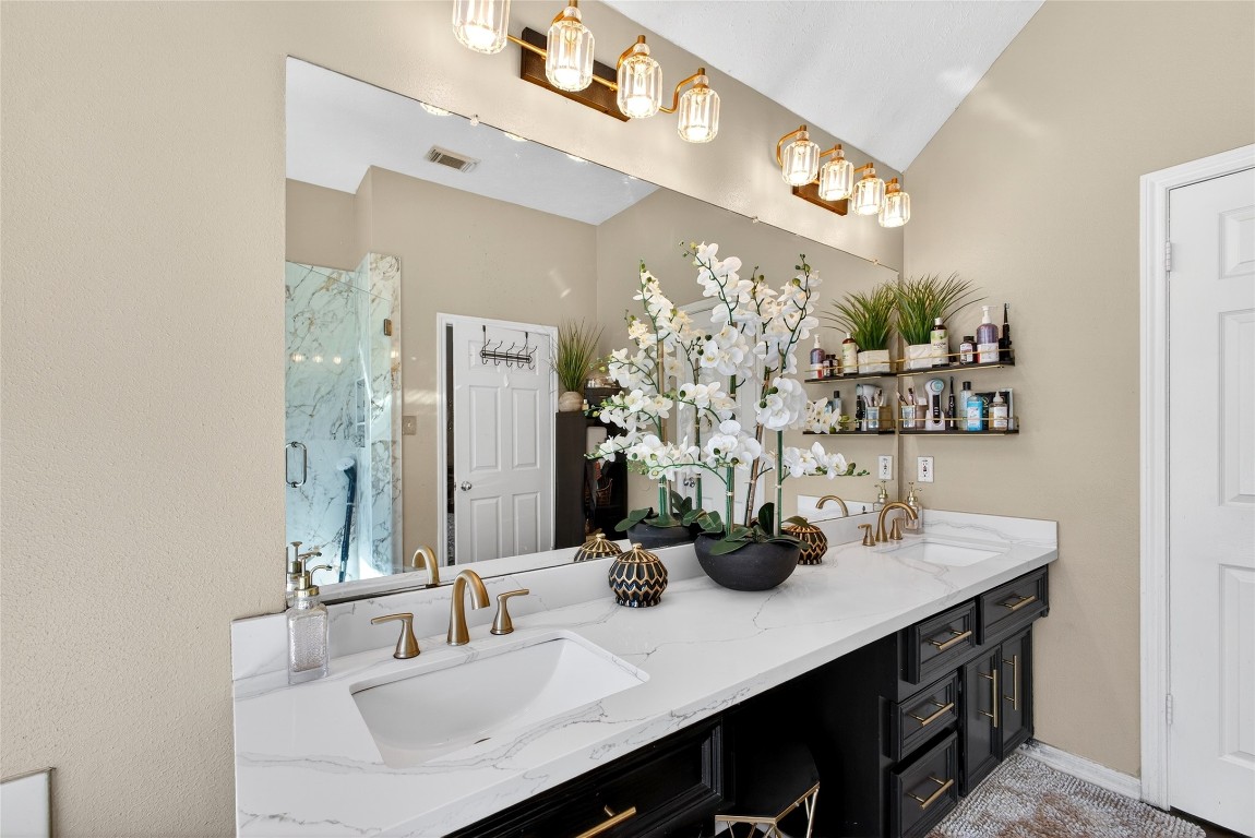 19115 Keyturn Lane Humble, TX 77346 - Photo 18 of 32 a bathroom with a sink double vanity and a mirror