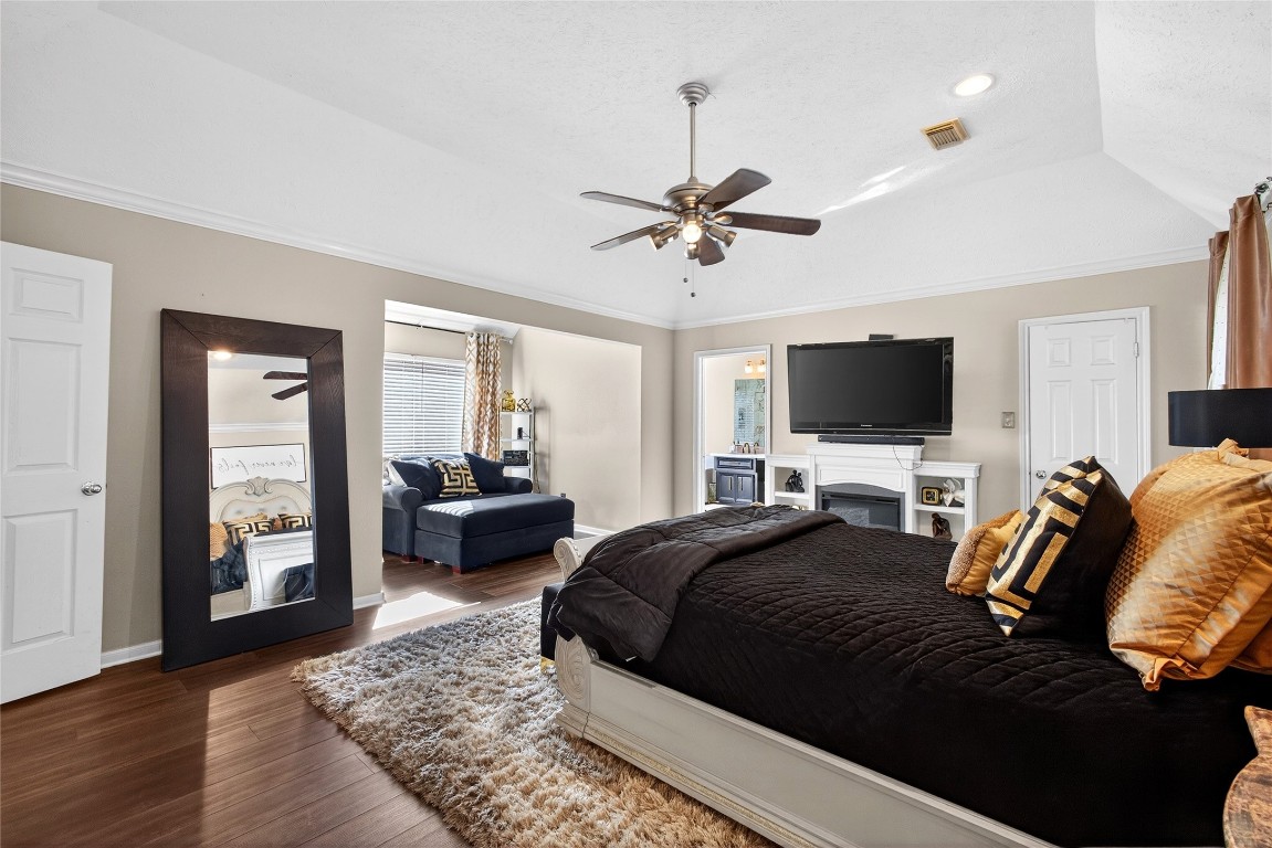 19115 Keyturn Lane Humble, TX 77346 - Photo 19 of 32 a bedroom with a bed and a flat screen tv