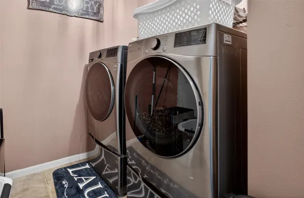 a utility room with dryer and washer