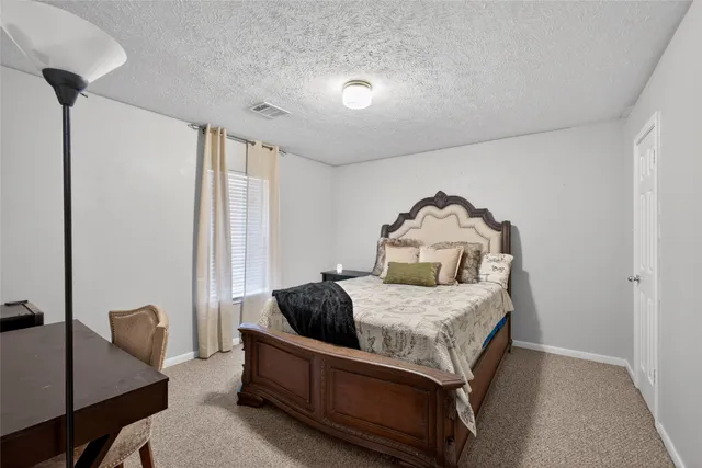 a room with a bed and a chair