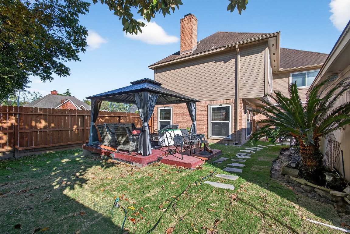 19115 Keyturn Lane Humble, TX 77346 - Photo 26 of 32 a view of a house with backyard and sitting area